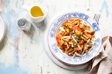 Vegan salad with chanterelle mushrooms, fresh paprika, celeriac and parsley with olive oil and lemon dressing.