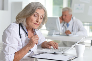 Fototapeta premium Portrait of professional doctors working in cabinet