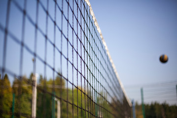 Volleyball net stretched above the ground. Sports equipment for playing ball. Sports game...