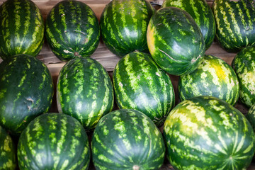Watermelons in the market. Big berry. Juicy watermelon lies on the counter. Southern fruit.