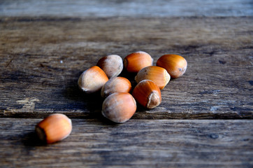 Hazelnuts on a background of old boards.