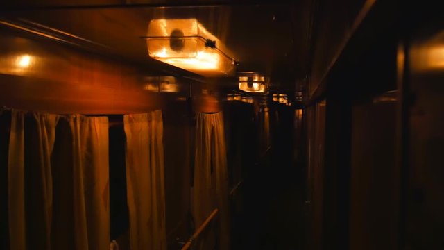 Very dark in a train car. Interior inside lifestyle train, view corridor in the compartment car from night moving train railway Ukrain.