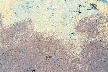 White and beige paint on the wall of house. Construction and repair.