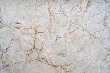 Cracks of gray marble. Wall of house. Construction industry.