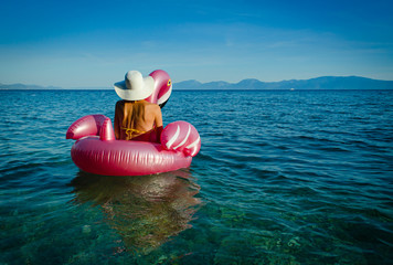 woman on  flamingo floatie