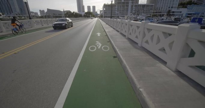 Camera facing down towards bike lane on Venetian Causeway Miami FL 4k 60p
