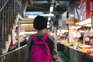 traveling woman in the traditional marketplace