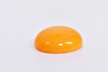 Egg yolk on the white background