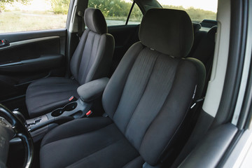 Car interior, part of front seats, close