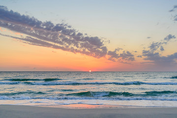 Fototapeta na wymiar Long wave on the coast, dawn on the sea, Tunisia