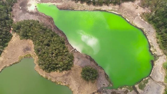 volcanic sulfur lake telaga warna in dieng plateau, java Indonesia. mountain tropical landscape lake with green water among mountains. this lake is one mainstay tourist destinations in Wonosobo