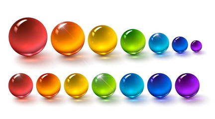 Set of multi-colored glass balls on a white background, round drops of rainbow colors