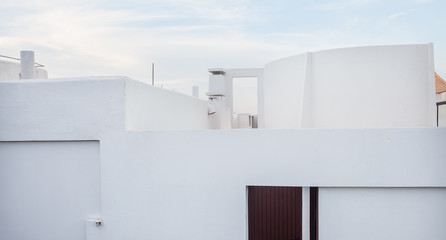 white shapes of Mediterranean houses under the blue sky