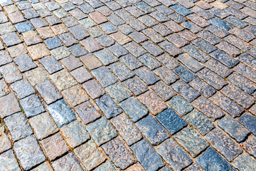 Background of cobblestones making from rough stone blocks