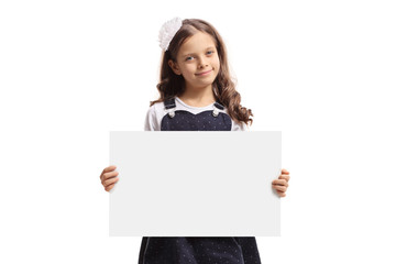 Fototapeta premium Young girl holding a blank signboard