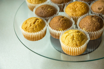 Muffins in molds on a glass plate