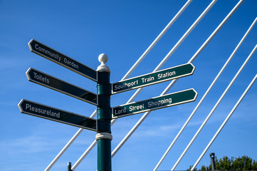 Fototapeta premium Wooden guide poles and tourists information poles in Southport, England.