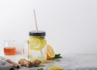 Ginger Water in Glass jar With Lemon and Honey, Horizontal Orientation, White Background, Copy Space