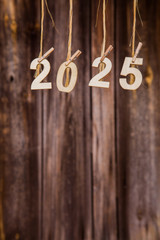 New year calendar 2025 concept on old brown wood