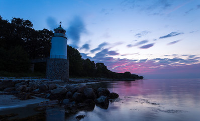 Lighthouse Taksensand on the Danish island als at sunset