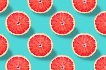 Foto auf Glas Vivid fruit pattern of fresh grapefruit on colourful background © Rodica Ciorba