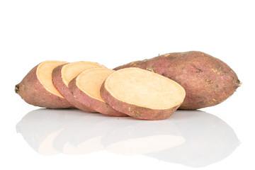 Group of one whole four slices of fresh brown sweet potato isolated on white background