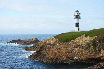 Fototapeta na wymiar Illa Pancha lighthouse in Ribadeo, Galicia, Spain