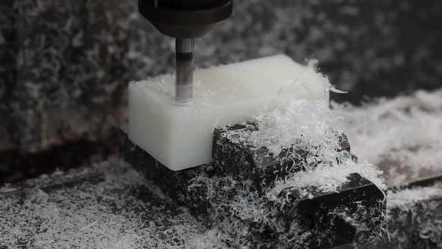 Tool milling plastic at CNC machine, speed up footage