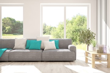 Stylish room in white color with sofa and summer landscape in window. Scandinavian interior design. 3D illustration