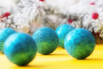Christmas balls over holiday background