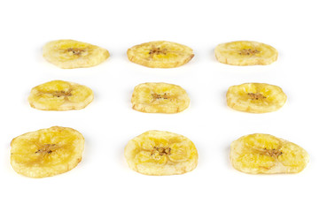 Group of nine slices of sweet yellow dry banana isolated on white background