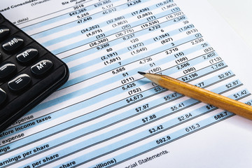 Accounting business. Calculator with accounting report and financial statement