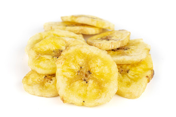 Lot of slices of sweet yellow dry banana isolated on white background