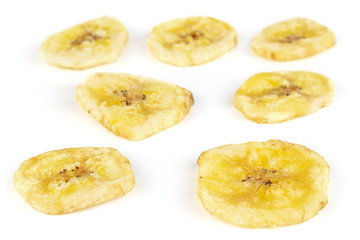 Group of seven slices of sweet yellow dry banana isolated on white background