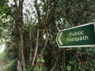 Public Footpath Sign With Lichen country lane