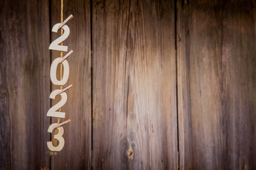 New year calendar 2023 concept on old brown wood