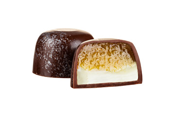 Cut luxury handmade bonbon with  soft cream and fruit filling isolated on white background