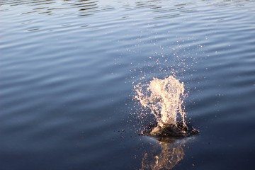 Splash from rock thrown in water - 4