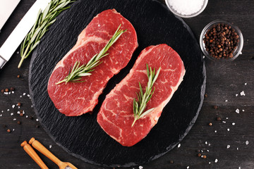 Fototapeta na wymiar Steak raw. Barbecue Rib Eye Steak or rump steak on dark rustic table