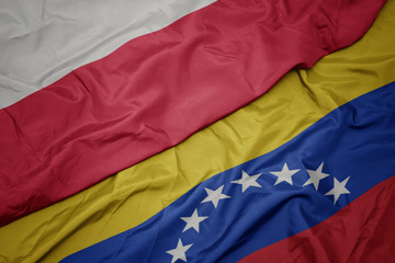 waving colorful flag of venezuela and national flag of poland.