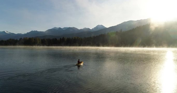 Kayaking On A Mountain Lake At Sunrise
