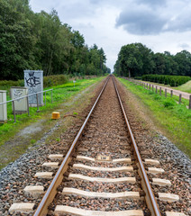 Fototapeta na wymiar Vanishing rail road track in the Winterswijk area in the Netherlands
