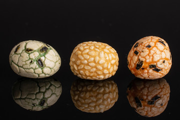 Group of three whole rice japan assortment isolated on black glass