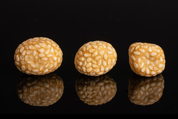Group of three whole sesame rice japan assortment isolated on black glass