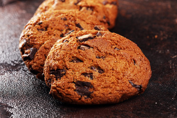 Chocolate cookies on wooden table. Chocolate chip cookies shot on table