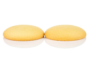Group of two whole sweet golden sponge biscuit isolated on white background