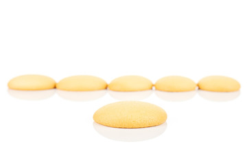 Group of six whole sweet golden sponge biscuit isolated on white background