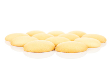 Lot of whole sweet golden sponge biscuit in one group isolated on white background