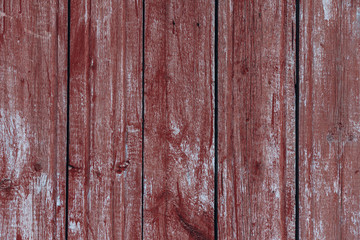 Fototapeta na wymiar Red wood background. Wall of red house made of planks, photo background