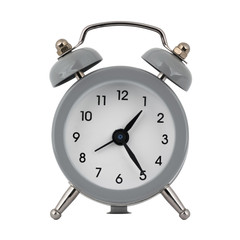 A gray clock with an alarm clock on a white background with arrows showing the time one hour twenty five minutes or thirteen hours twenty five minutes